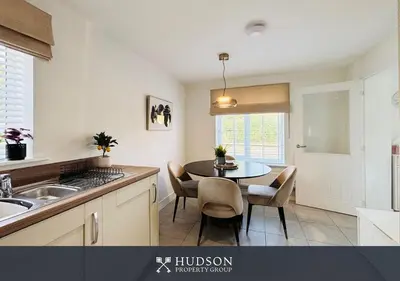 a kitchen and dining room with a table and chairs at 3 Bed Stylish Shrewsbury Home in Shrewsbury