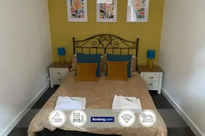 a bedroom with a large bed with four pillows at Spacious 5 Family Rooms House By Shropshire Escapes Short Lets & Serviced Accommodation Shrewsbury With Free WiFi in Shrewsbury
