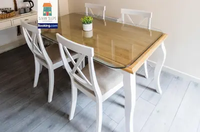 a dining room table with four chairs around it at Spacious 5 Family Rooms House By Shropshire Escapes Short Lets & Serviced Accommodation Shrewsbury With Free WiFi in Shrewsbury