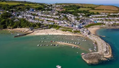 an aerial view of a harbor with boats in the water at Lodge - Sleeps 4 Near beach & Free parking in Llanina
