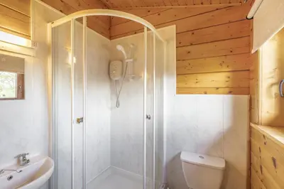 a bathroom with a shower and a toilet and a sink at 2 Bed in Llandinam oc-t32993 in Llandinam
