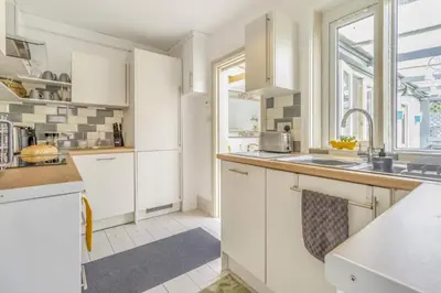 a kitchen with white cabinets and a sink at 3 Bed in Forden oc-c30173 in Forden