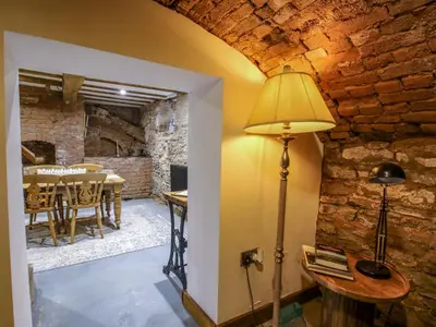 a floor lamp in a room with a dining room at Raven Lane Retreat in Ludlow