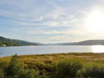 a view of a lake with mountains in the background at Sisial y Llyn in Bala