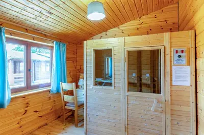 a wooden room with a chair and a wooden wall at 1 Bed in Llandinam oc-t33065 in Llandinam