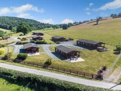an aerial view of a farm with buildings on a hill at 1 Bed in Llandinam oc-t33065 in Llandinam