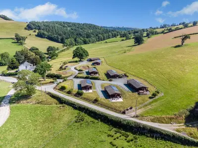 an aerial view of a house in a field at 1 Bed in Llandinam oc-t33065 in Llandinam