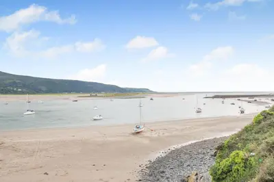 a view of a beach with boats in the water at 4 Bed in Barmouth oc-n32921 in Barmouth