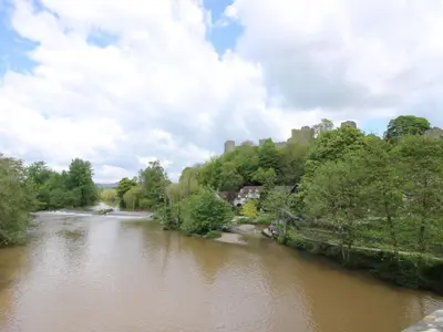 a view of a river from a bridge at Middle Cottage in Ludlow