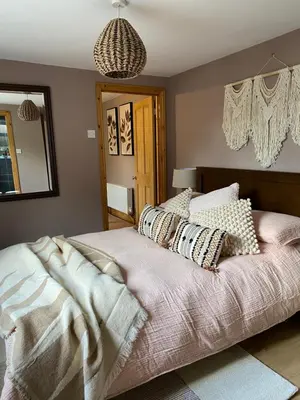a bedroom with a bed with pillows on it at Studio Twelve in Brecon