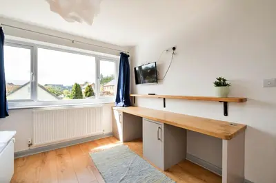 a home office with a desk and a window at Finest Retreats - Elizabeth House in Kington