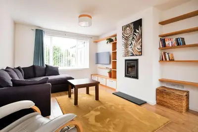 a living room with a couch and a table at Finest Retreats - Elizabeth House in Kington