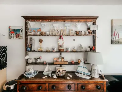 an old wooden shelf with items on it at Ty Fferm Bargoed in Aberaeron