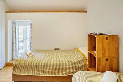 a bedroom with two beds and a book shelf at 3 Bed in Defynnog oc-p33133 in Devynock
