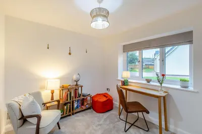 a living room with a desk and chairs and a window at 4 Bed in Llanigon oc-t33091 in Llanigon