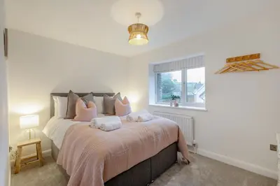 a bedroom with a large bed with pink pillows at 4 Bed in Llanigon oc-t33091 in Llanigon