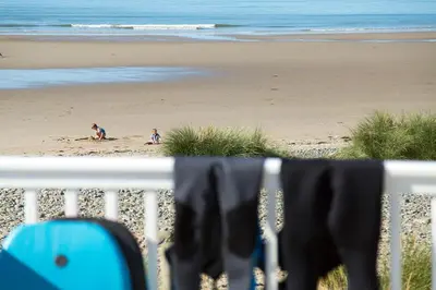 two children playing in the sand on the beach at Barmouth Bay Holiday Park in Barmouth