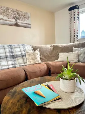 a living room with a couch and a coffee table at Modern 1 Bed Apartment Sleeps 2 in Llanbadarn-fawr
