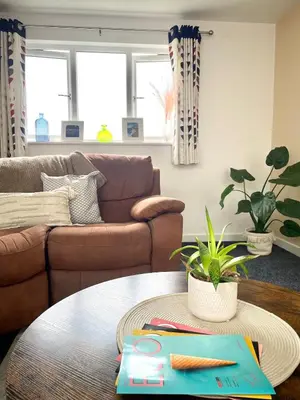 a living room with a couch and a table at Modern 1 Bed Apartment Sleeps 2 in Llanbadarn-fawr