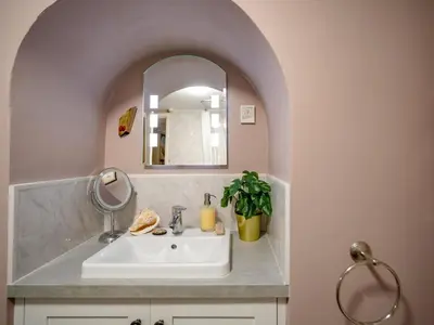 a bathroom with a sink and a mirror at Pass the Keys Charming 2 Bed Townhouse Short Walk To The River in Shrewsbury