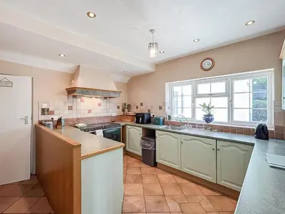 a kitchen with a sink and a counter top at Brithdir in Welshpool