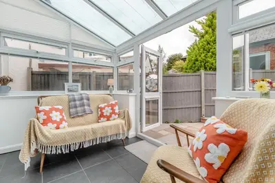 a conservatory with two chairs and a glass roof at 2 Bed in Weobley oc-c32945 in Weobley