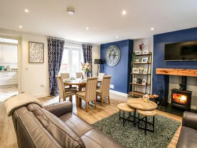 a living room with a couch and a table at 6 Upperfield Street in Dolgellau