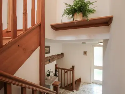 a staircase in a house with a potted plant at Malt House in Bishops Castle
