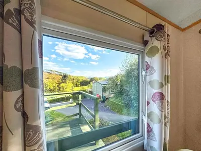 a window in a room with a view of a bridge at Hafren View in Machynlleth