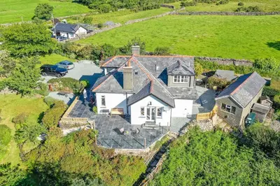 an aerial view of a large white house at Artro in Llanbedr