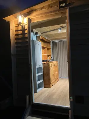 a view of a kitchen through a doorway at The Rheidol Shepherds Hut in Aberystwyth