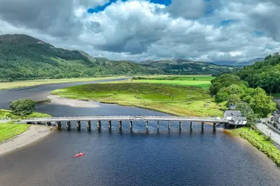 an aerial view of a bridge over a river at Stabl-Bennar in Dyffryn