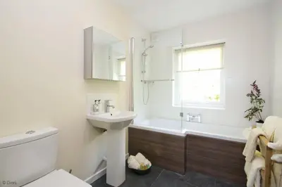 a bathroom with a sink and a toilet and a tub at Hen-Feudy in Dyffryn