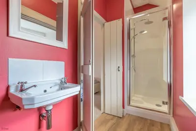 a bathroom with a sink and a shower at Erw-Dinmael in Corwen