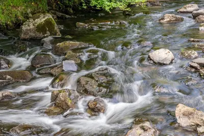 a stream of water with rocks in a river at Allt-Goch in Llanbedr