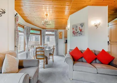 a living room with a couch and a table at Beautiful Home In Bala, Gwynedd W in Llanfor