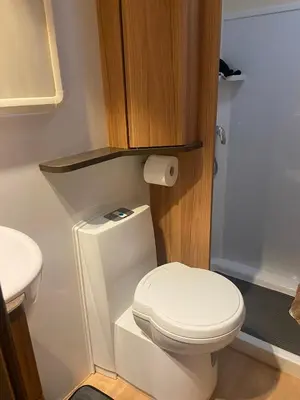 a bathroom with a white toilet and a sink at Hyssington Heights in Hyssington