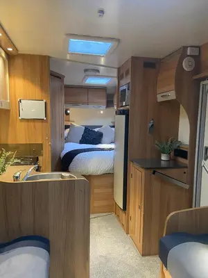 a small room with a bed and a kitchen at Hyssington Heights in Hyssington