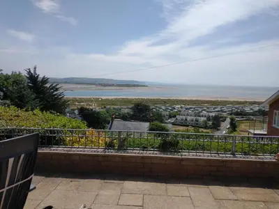 a view of the ocean from the balcony of a house at High Mead - family house with spectacular views in Aberdyfi