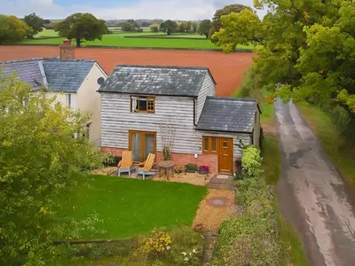 an aerial view of a house with a driveway at Archers Cottage in Leominster