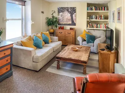 a living room with a couch and a coffee table at Kookaburra Lodge in Brecon