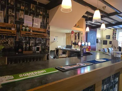 a bar in a restaurant with a counter top at Twin room - The Unicorn Hotel in Llanidloes