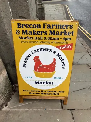 a sign for a farmers and makers market on a sidewalk at Charming 2 bedroom cottage in Brecon - families and pets welcome! in Brecon