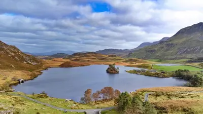 a large lake in the middle of a mountain at Finest Retreats - Pandy Traditional Yurt in Dolgellau