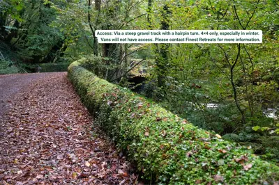 a hedge on the side of a road at Finest Retreats - Pandy Mongolian Yurt in Dolgellau
