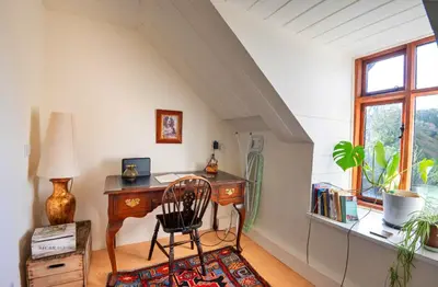 an attic room with a desk and a chair at Finest Retreats - Waen Fechan in Dolgellau