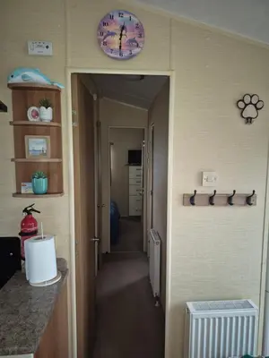 a hallway leading to a room with at The Dancing Dolphin, 124 Aber Bay Holiday Park, Clarach, Aberystwyth in Aberystwyth