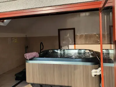 a jacuzzi tub in the corner of a room at Hobby Stable Cottage in Cynghordy