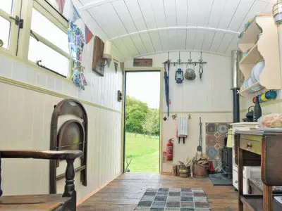an interior view of a kitchen in a tiny house at Cwt Cwtshlyd in Tregaron