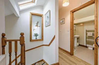 a hallway with a staircase leading to a bathroom at 1 Bed in Cilmery oc-g32770 in Builth Road